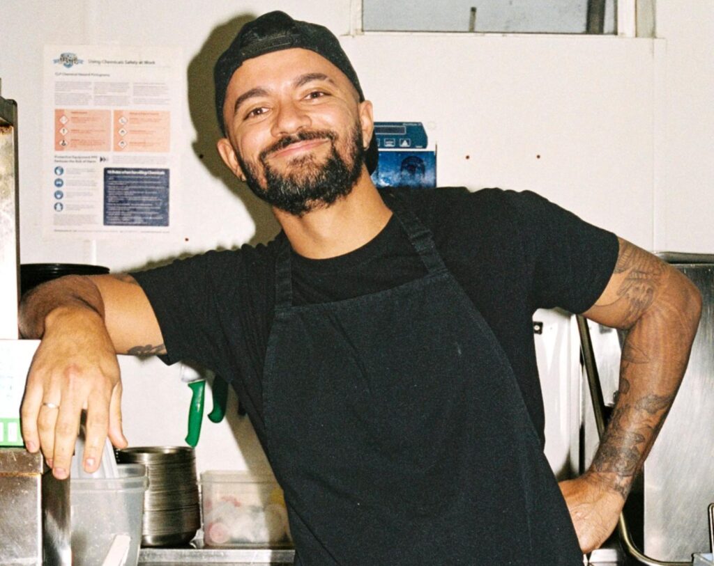 Restaurant employee smiling at the camera