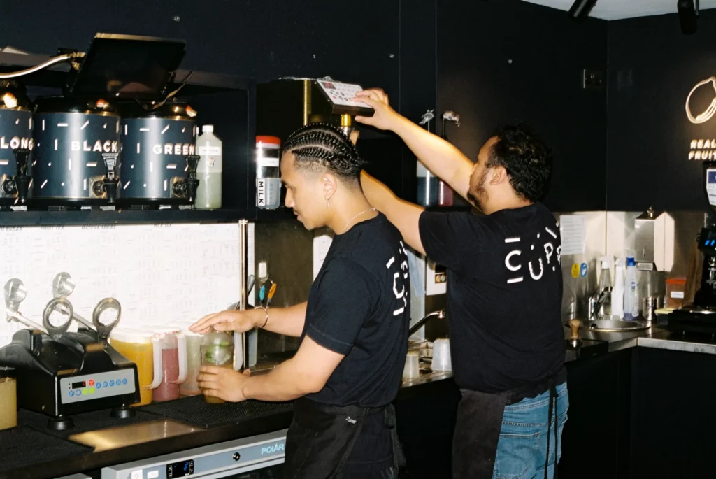Tea shop staff members preparing bubble tea