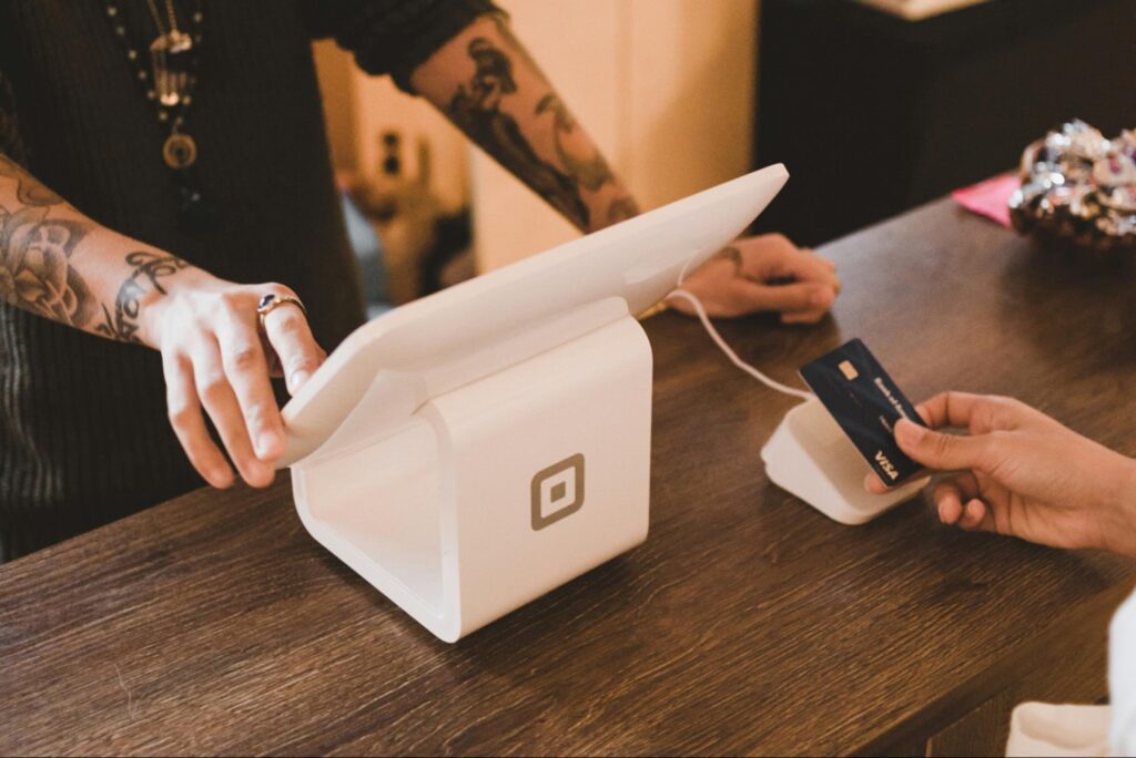 A customer paying for food and tipping staff with Square EPOS