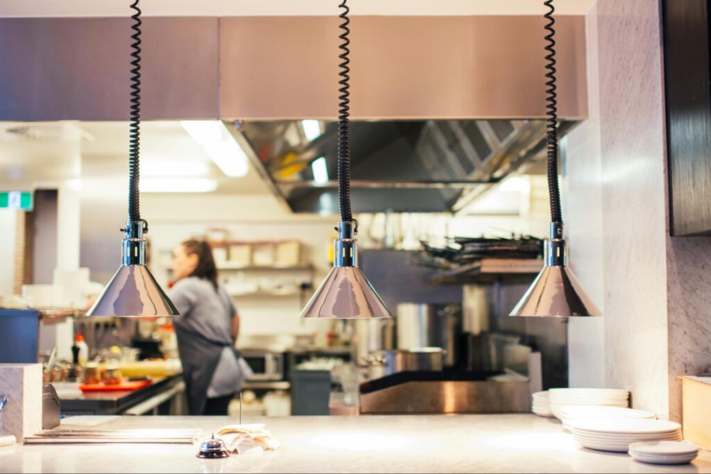 Restaurant kitchen with one member of staff