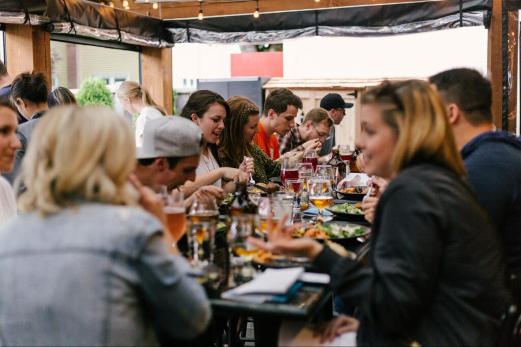 People sat enjoying food in a restaurant