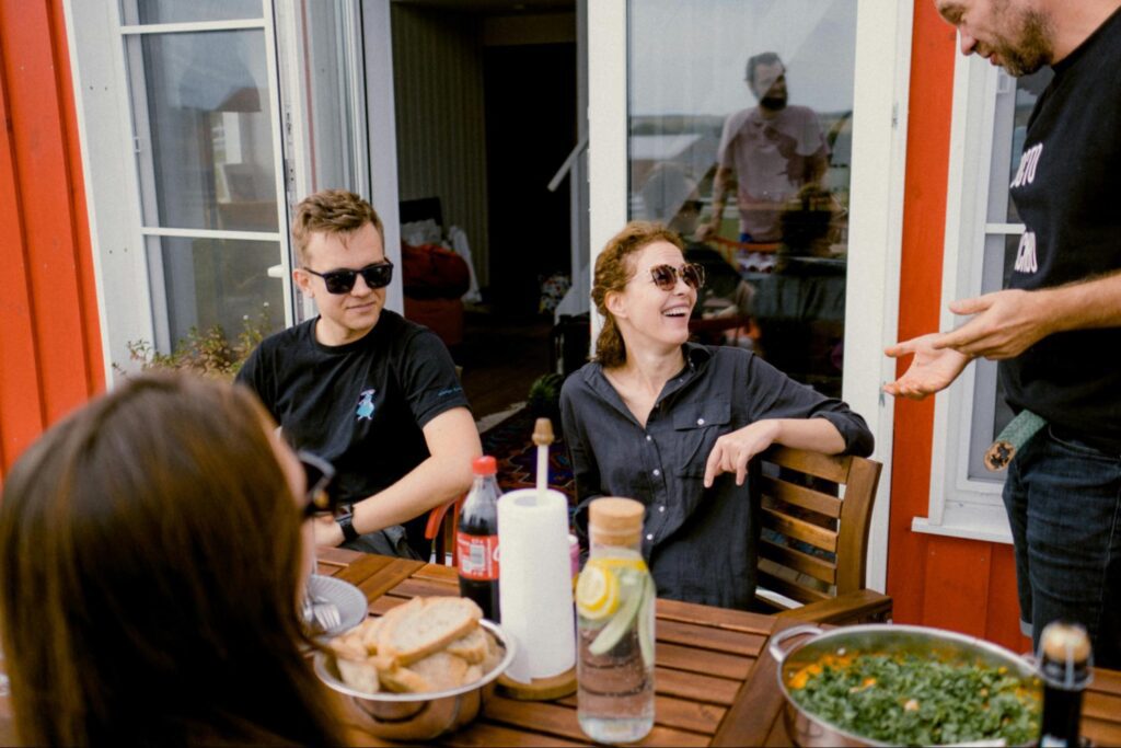 Group of friends smiling at waiter